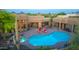 Home features a backyard pool and spa with an outdoor seating area and desert landscaping at 30600 N Pima N Rd # 81, Scottsdale, AZ 85266