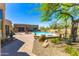 A luxury home featuring a beautiful private pool, desert landscaping, and a resort-style lounge area, ideal for relaxation at 30600 N Pima N Rd # 81, Scottsdale, AZ 85266