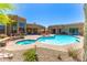 A stunning backyard pool with a built-in spa, desert landscaping, and rock features, perfect for entertaining and relaxation at 30600 N Pima N Rd # 81, Scottsdale, AZ 85266