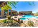 Backyard pool featuring stone accents, desert landscaping, clear blue water, and privacy creating a relaxing outdoor oasis at 30600 N Pima N Rd # 81, Scottsdale, AZ 85266
