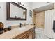 Bright bathroom with a granite vanity, ceramic tile shower, and bronze fixtures at 30600 N Pima N Rd # 81, Scottsdale, AZ 85266