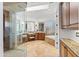 Bright bathroom featuring dual vanities, granite countertops, a walk-in shower, and a soaking tub at 30600 N Pima N Rd # 81, Scottsdale, AZ 85266