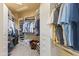Well-organized walk-in closet with custom shelving, multiple hanging rods, and plenty of storage at 30600 N Pima N Rd # 81, Scottsdale, AZ 85266