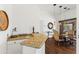 Elegant dining area featuring granite bar with wine storage and decorative lighting at 30600 N Pima N Rd # 81, Scottsdale, AZ 85266