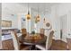 Elegant dining room featuring a dark wood table and decorative hanging light fixtures, offering a warm, inviting space at 30600 N Pima N Rd # 81, Scottsdale, AZ 85266