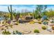 Community entrance showcases custom stonework, desert landscaping, and clear signage at 30600 N Pima N Rd # 81, Scottsdale, AZ 85266
