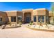Stunning home boasts a desert landscape, stone accents, and a brick paved private driveway at 30600 N Pima N Rd # 81, Scottsdale, AZ 85266