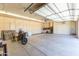 Spacious garage with ample storage, workbench and epoxy flooring at 30600 N Pima N Rd # 81, Scottsdale, AZ 85266
