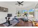 Home gym with hardwood floors, large windows, and an array of fitness equipment at 30600 N Pima N Rd # 81, Scottsdale, AZ 85266
