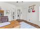Bright home office with natural wood floors, area rug, and electric guitars hung on the wall at 30600 N Pima N Rd # 81, Scottsdale, AZ 85266