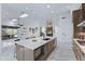 Spacious kitchen with a large island, breakfast bar, and views into the Gathering room at 30600 N Pima N Rd # 81, Scottsdale, AZ 85266