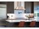Close-up of a well-equipped kitchen with stainless steel appliances, a gas range, and a stylish faucet at 30600 N Pima N Rd # 81, Scottsdale, AZ 85266