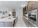 Spacious kitchen with a large island, marble countertops, and stainless steel appliances at 30600 N Pima N Rd # 81, Scottsdale, AZ 85266