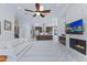 Inviting living room with fireplace, view of the kitchen, and marble floors at 30600 N Pima N Rd # 81, Scottsdale, AZ 85266