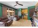 Entertainment space with wet bar, wood paneling, and leather furniture, with walkout access to pool at 30600 N Pima N Rd # 81, Scottsdale, AZ 85266