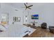 Comfortable main bedroom with dark wood floors and a media center at 30600 N Pima N Rd # 81, Scottsdale, AZ 85266