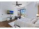Bright main bedroom with a view of the pool and outdoor area at 30600 N Pima N Rd # 81, Scottsdale, AZ 85266