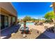 Lush pool area with fountain and comfortable lounge seating for outdoor relaxation at 30600 N Pima N Rd # 81, Scottsdale, AZ 85266