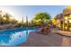 Captivating pool area with inviting lounge chairs and lush desert landscaping, perfect for relaxation at 30600 N Pima N Rd # 81, Scottsdale, AZ 85266