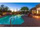 A stunning desert home boasts a tranquil pool and spa surrounded by desert landscaping and cozy poolside seating at 30600 N Pima N Rd # 81, Scottsdale, AZ 85266