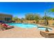 Sparkling pool and spa surrounded by desert landscaping and comfortable lounging at 30600 N Pima N Rd # 81, Scottsdale, AZ 85266