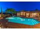 Backyard oasis with a pool, spa, comfortable lounge chairs, and a stunning desert landscape for relaxation and entertainment at 30600 N Pima N Rd # 81, Scottsdale, AZ 85266
