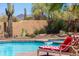 Beautiful pool area with desert landscaping and cozy lounge chairs at 30600 N Pima N Rd # 81, Scottsdale, AZ 85266