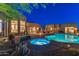 Beautiful backyard with a sparkling pool, hot tub, outdoor seating, desert plants, and a luxurious outdoor living space at 30600 N Pima N Rd # 81, Scottsdale, AZ 85266