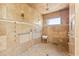 Walk-in shower with accessible features, travertine surround, and multiple shower heads at 30600 N Pima N Rd # 81, Scottsdale, AZ 85266