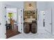 Elegant wine room with rustic barrel accents and a decorative stone wall at 30600 N Pima N Rd # 81, Scottsdale, AZ 85266