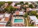 An aerial view of the community pool and hot tub with patio seating and nearby walkways at 3131 W Cochise Dr # 144, Phoenix, AZ 85051