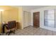 Entryway with storage and desk offers a functional space with closet and natural light at 3131 W Cochise Dr # 144, Phoenix, AZ 85051