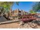 Building exteriors amid desert landscaping and shade structures at 3131 W Cochise Dr # 144, Phoenix, AZ 85051