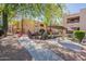 Community grounds featuring walkways, shade structures, rock features, and building views at 3131 W Cochise Dr # 144, Phoenix, AZ 85051