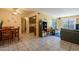 Inviting living space featuring tile floors, dining area, and a view into the kitchen at 3131 W Cochise Dr # 144, Phoenix, AZ 85051
