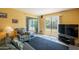 Bright living room with comfortable seating, natural light, and sliding glass door at 3131 W Cochise Dr # 144, Phoenix, AZ 85051
