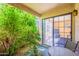 Cozy patio area with a view of lush greenery and a sliding door to the indoors at 3131 W Cochise Dr # 144, Phoenix, AZ 85051