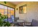 Relaxing outdoor patio space with chairs and table, adjacent to the living room at 3131 W Cochise Dr # 144, Phoenix, AZ 85051