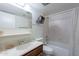 Bright bathroom featuring a shower-tub combo, white vanity, and neutral tile at 3131 W Cochise Dr # 269, Phoenix, AZ 85051