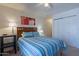 Well-lit bedroom showcasing a queen-size bed and spacious closet at 3131 W Cochise Dr # 269, Phoenix, AZ 85051