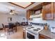 Open kitchen flows into the dining and living area, creating an inviting and connected space at 3131 W Cochise Dr # 269, Phoenix, AZ 85051