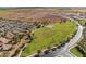 Aerial view of community and surrounding area with green space at 38065 W Frascati Ave, Maricopa, AZ 85138