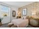 This bedroom features unique decor, a window, and two dressers at 38065 W Frascati Ave, Maricopa, AZ 85138