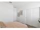 This bedroom has neutral colored walls, doors, and neutral bedding at 38065 W Frascati Ave, Maricopa, AZ 85138