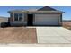 Charming single-story home featuring neutral tones, a two-car garage, and drought-tolerant landscaping at 38065 W Frascati Ave, Maricopa, AZ 85138