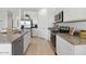 Well-equipped kitchen featuring stainless steel appliances and granite countertops at 38065 W Frascati Ave, Maricopa, AZ 85138