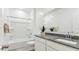 Clean, bright bathroom with a tub, shower, and granite countertop at 38100 W Bello Ln, Maricopa, AZ 85138