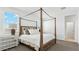 Beautiful bedroom with a four-poster bed and bright, natural light at 38100 W Bello Ln, Maricopa, AZ 85138