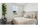 Well-lit bedroom with a large window and comfortable decor, perfect for relaxation at 38100 W Bello Ln, Maricopa, AZ 85138