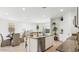 Beautiful modern kitchen with an island, stainless appliances, and an open layout to the living spaces at 38100 W Bello Ln, Maricopa, AZ 85138
